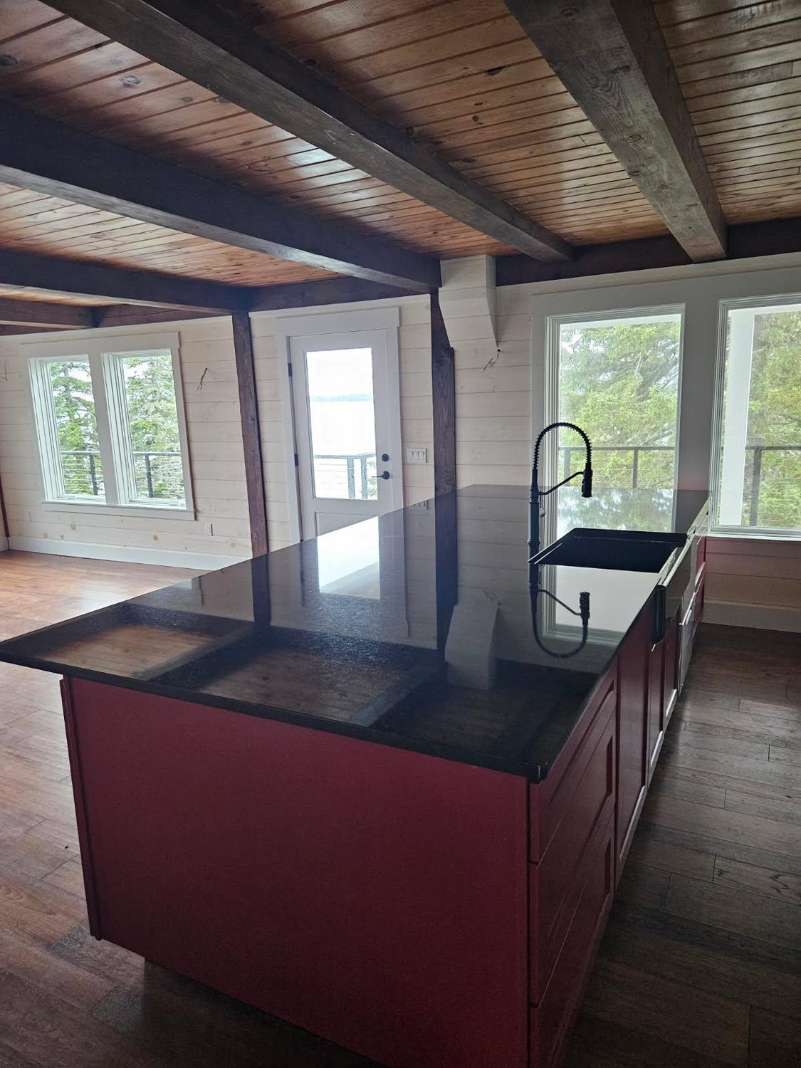 Kitchen island with water view in a home built by L.E. Nichols & Son LLC — Harrington, ME