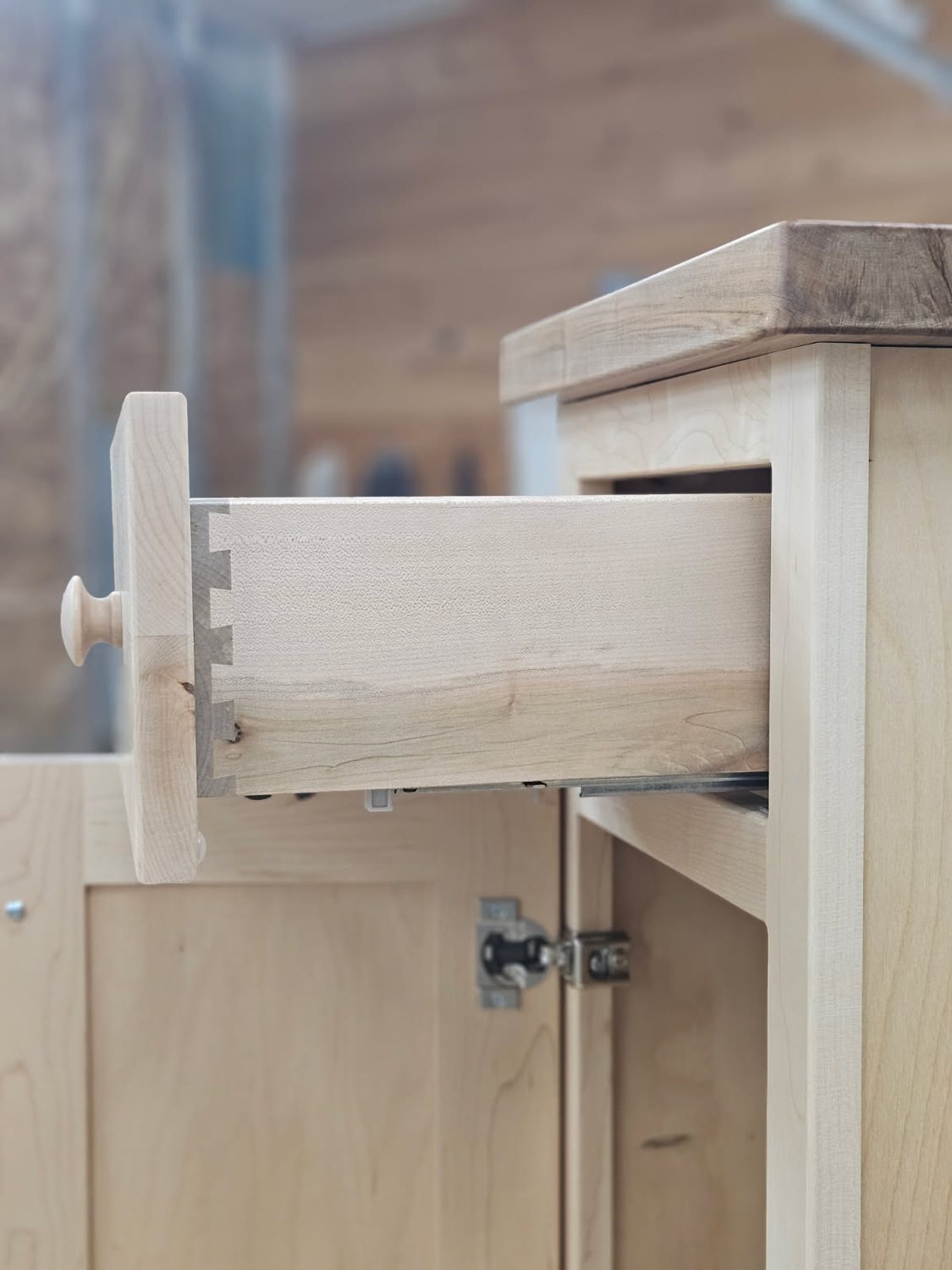 Close-up of dovetail joinery on a hand-built cabinet drawer