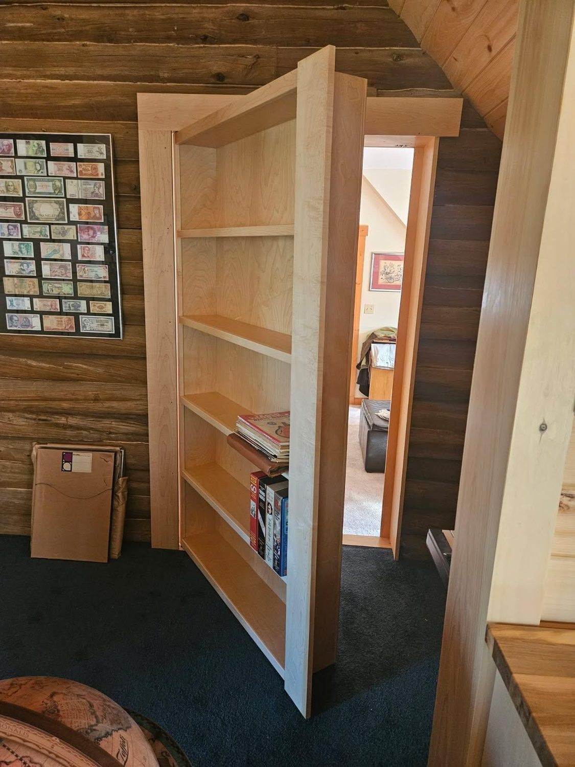 Custom built-in bookshelf that swings open as a hidden door