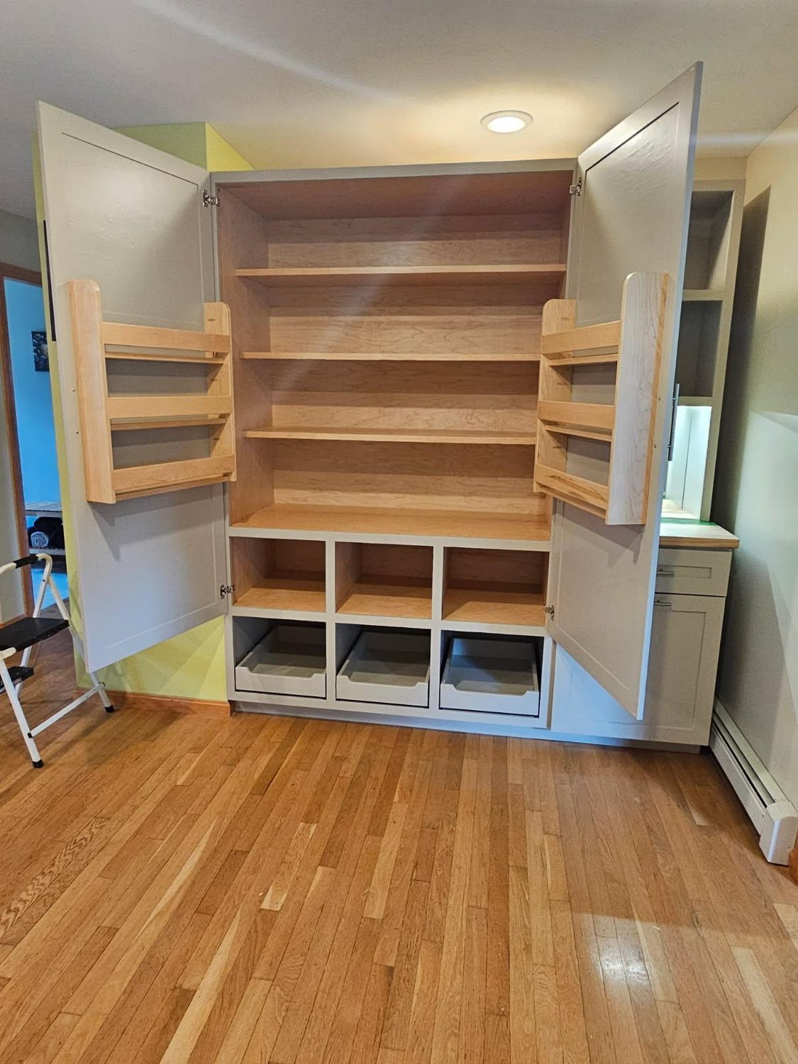 Custom built-in pantry cabinet with pull-out shelving